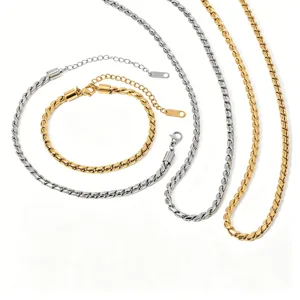 Detailed view of gold and silver twisted chain necklaces and bracelet set in stainless steel.
