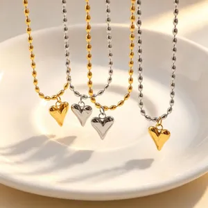 Exquisite detail of two-tone heart bead necklaces, elegant fashion jewelry for women.
