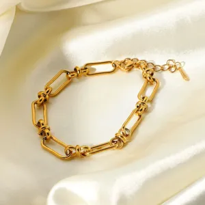Gold stainless steel link bracelet detail, geometric chain design for women fashion jewelry.