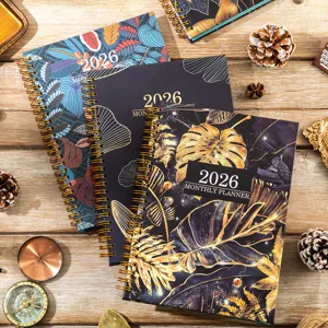 Detailed close-up view of 2026 botanical floral monthly planner notebook with spiral.