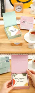 Inspirational quote cards set in elegant boxes with daily positive motivational messages.