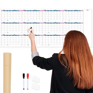 Oversized undated dry erase wall calendar with pens, perfect for office schedule planning.