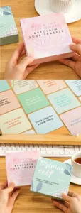 Inspirational affirmation cards set in a box with positive quotes for daily motivation.