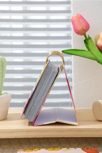2027 English desk calendar with metal ring binding and sturdy standing base for office.