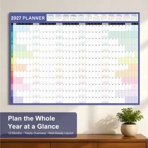 Detailed view of the 2027 wall planner hanging in a neat room setup with a small green plant.