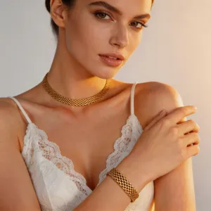 Gold titanium steel woven choker necklace and bracelet set for women, fashionable mesh design.