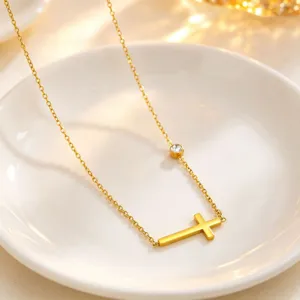 Gold titanium steel cross necklace with diamond accent, minimalist luxury style for women.