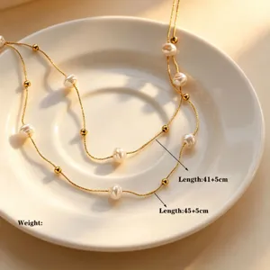 Elegant double layer baroque pearl necklace with delicate gold chain for women and girls.