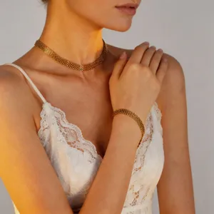 Gold mesh snake chain necklace and bracelet set for women, elegant titanium steel jewelry detail.