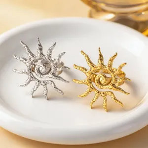 Unique sunburst design metal ring detail, chic gold and silver textured fashion jewelry piece.