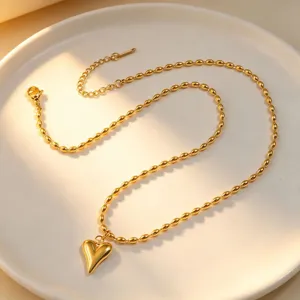Gold heart pendant bead chain necklace, elegant titanium steel clavicle jewelry for women.