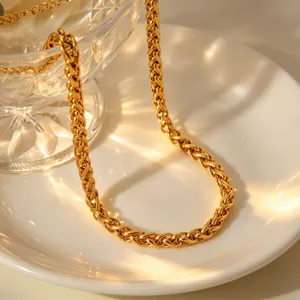 Detailed view of a stylish gold-plated stainless steel chain necklace, elegant and trendy jewelry.