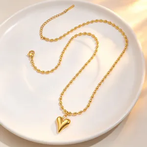 Gold puffed heart pendant beaded necklace for women, elegant clavicle chain fashion jewelry.