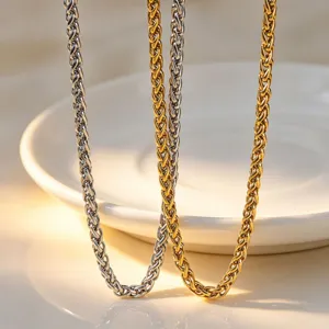 Stainless steel woven chain jewelry detail closeup shot, gold and silver color accessory