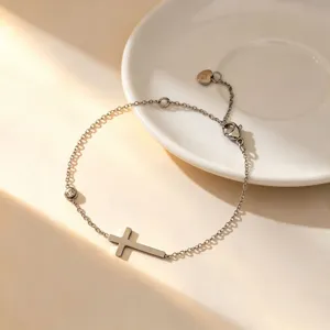 Minimalist titanium steel cross bracelet, delicate silver chain jewelry for everyday style.