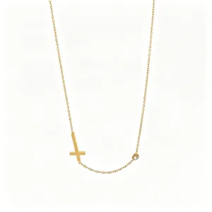 Minimalist gold cross necklace with dainty chain and crystal accent for women and girls daily wear.