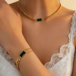 Gold titanium steel emerald necklace and bracelet set, elegant chic jewelry for women.