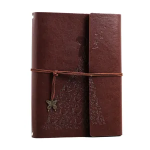 Vintage brown leather DIY photo album scrapbook with butterfly embossed design and pendant.