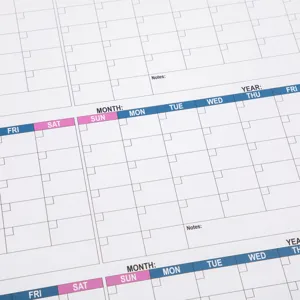 Undated giant wall calendar detail showing weekly grids, fill-in notes and planner layout.