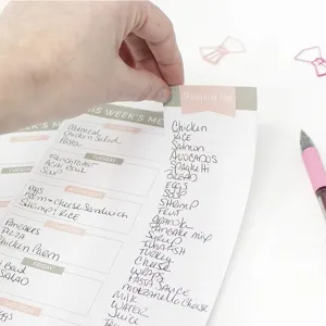 Minimalist weekly meal planner notepad with shopping list, tear-away daily recipe sheets.