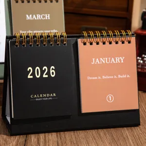 Close-up detail of the 2026 double-coil minimalist desk calendar with inspirational English quotes.