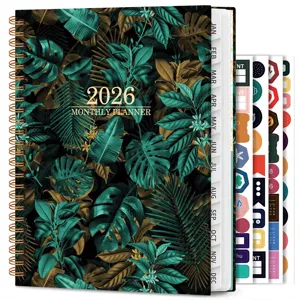 2026 monthly planner notebook with tropical leaf cover, tabbed calendar and sticker sheets.