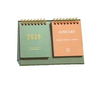 2026 desk calendar with double spiral binding, motivational quotes, and office planner.