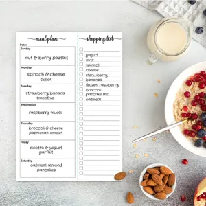 Weekly meal planner notepad with shopping list tear-off sheets for daily diet tracking.