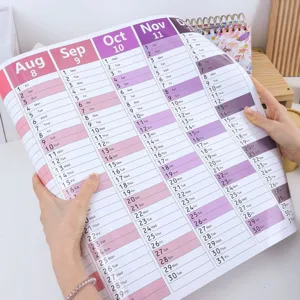 Detail shot of 2026 English wall calendar in roll packaging showing monthly layouts clearly.