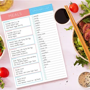 Detailed view of the weekly meal planner notepad, featuring daily menu and grocery list sections.