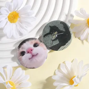 Cute cat pattern metal badge brooch detail close up, perfect for backpack and clothing decoration.