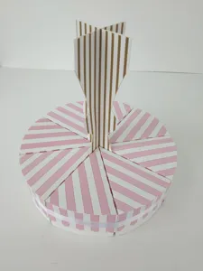 Pink striped wedding cake box detail, decorative pastry packaging and favor box display.