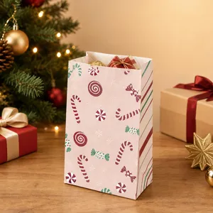 Detailed view of Christmas vertical paper gift bag with festive candy patterns and nice holiday setup.