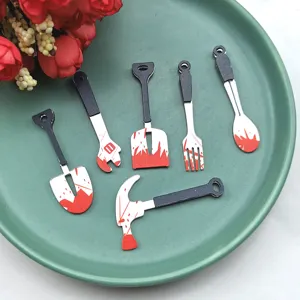 Halloween miniature tool resin charms detail view showing bloody shovel, hammer, and fork DIY parts.