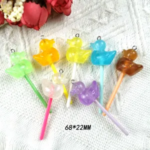 Close-up detail of colorful resin duck lollipop charms, perfect for DIY handmade jewelry.