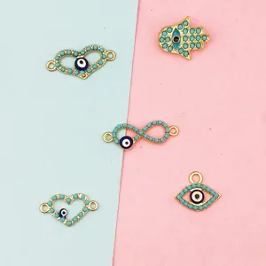 Gold-plated DIY jewelry charms featuring evil eye, hamsa hand, and heart motifs for handmade crafts.