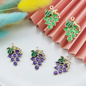 Close-up detail of cute grape charms, enameled alloy fruit pendants for DIY jewelry making.
