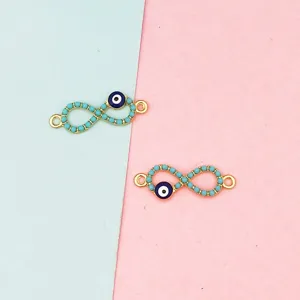 Gold evil eye infinity charm detail view for DIY handmade earrings and jewelry making.