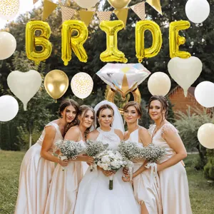 Detail shot of bridal shower party balloon set featuring gold BRIDE letters and white balloons.