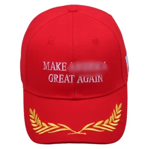 Classic red cotton baseball cap with embroidered wheat wreath and patriotic slogan design.