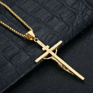 Detailed view of the golden stainless steel crucifix pendant necklace with a fine box chain design.
