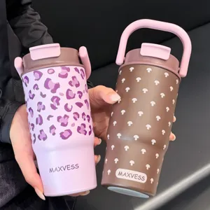Close-up of two Maxvess insulated tumblers with handles in leopard and mushroom prints