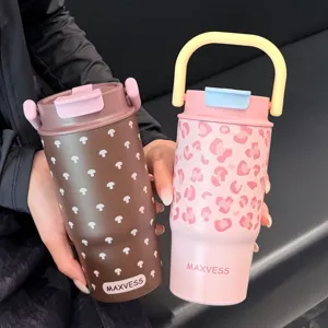 Close-up of insulated stainless steel tumblers with cute patterns and carry handles