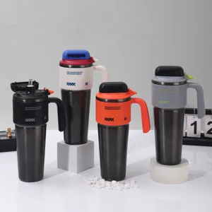 Portable large capacity insulated vacuum tumbler with handle and straw for car travel.