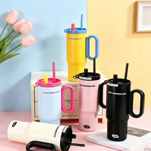 Large capacity 24oz stainless steel tumbler with handle and straw for cold and hot drinks.