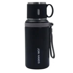 Botella térmica negra de acero inoxidable con tapa infusor y correa gris portátil.