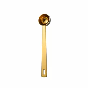 Gold stainless steel measuring spoon detail, 5ml coffee scoop with long handle for baking.