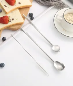Stainless steel straw spoon detail view, long handle coffee stirring spoon with cleaning brush included.