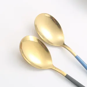 Stainless steel Korean soup spoon with gold bowl and colored handle for dining table use