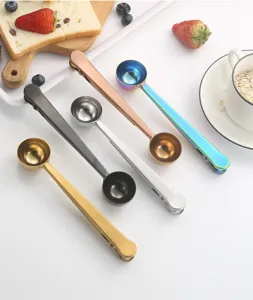 Stainless steel coffee measuring spoon with bag clip, multi-color kitchen baking tool detail view.